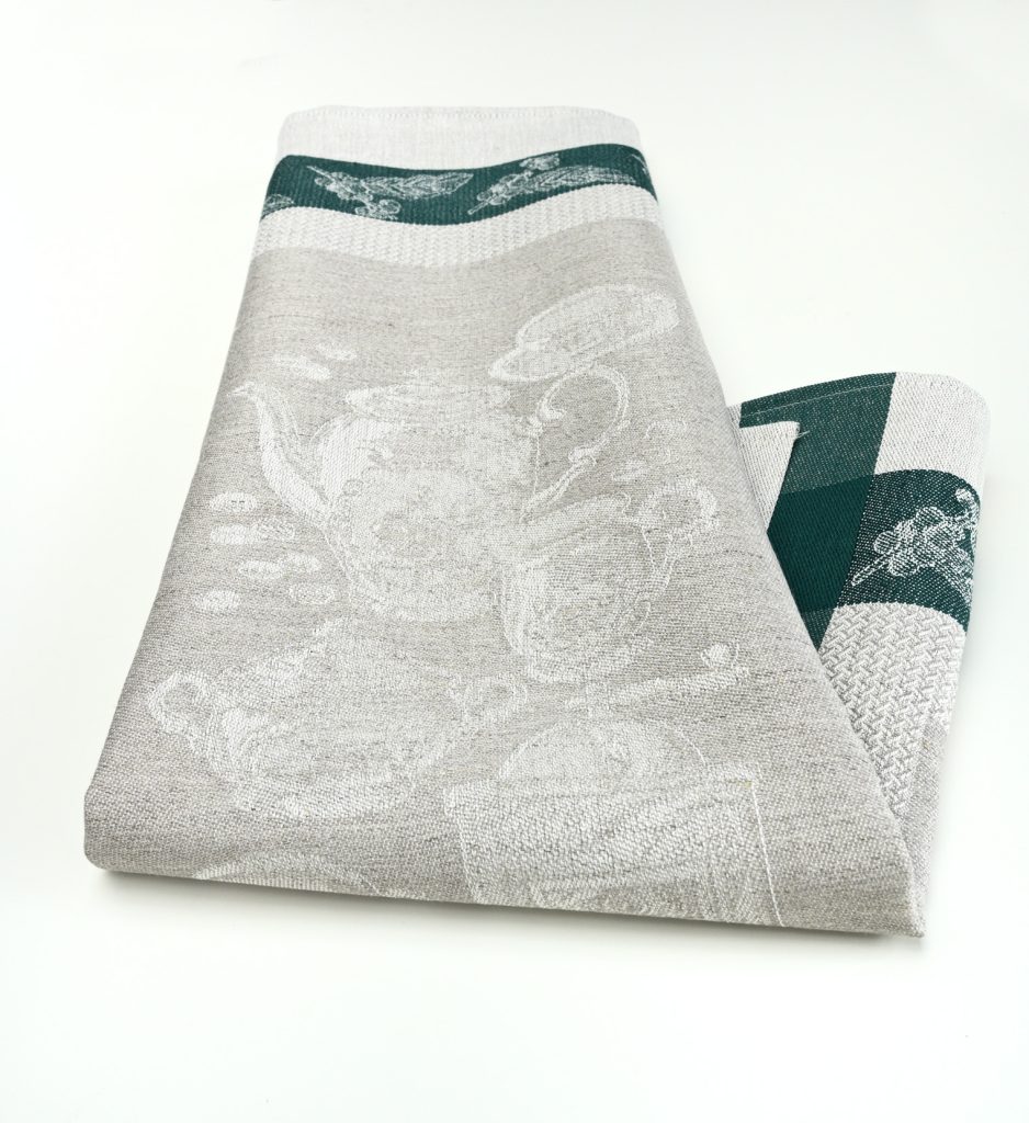 Our Coffee themed tea towel is a beautiful damask woven kitchen towel. Dark green borders frame the coffee design and contrasts nicely with the natural background.