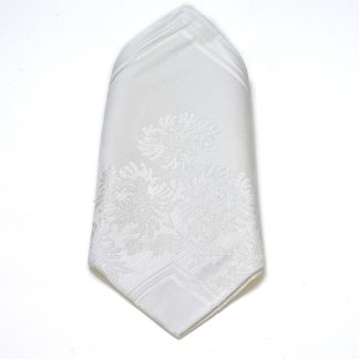 White dinner napkin with Contessa floral design.